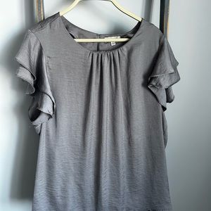 Used silver satin blouse.